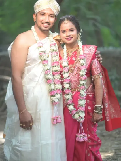 The happy couple. I created a traditional look for the bride that perfectly matched her red silk saree and the groom's simple, traditional attire.