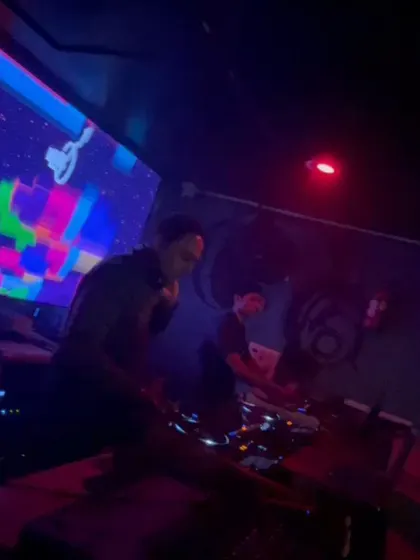 A shot of me and my fellow DJ working together during a Casino Royale theme night.