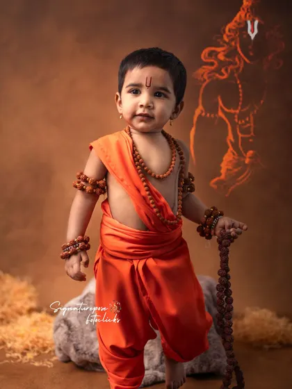 The grace and elegance of Lord Rama captured in a child's portrait. This image highlights the beautiful saffron costume and traditional markings, with a subtle artistic edit that adds to the divine feel.