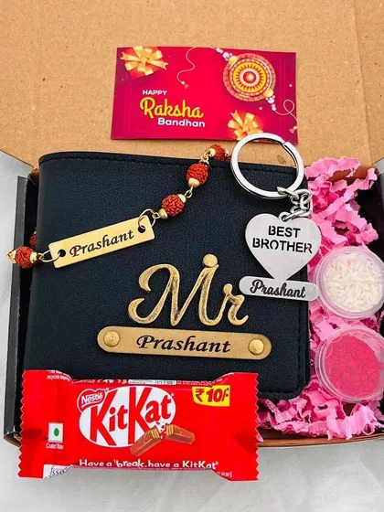 A compact Rakhi gift box with a personalized wallet, a "Best Brother" keychain, a rudraksh rakhi, and a KitKat.