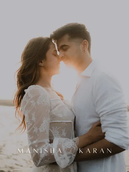 A romantic pre-wedding portrait during golden hour on the beach. The couple is close, their faces illuminated by the warm, setting sun.