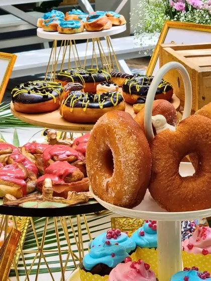 A colorful and fun donut wall from one of our events. This is a playful and interactive way to serve desserts that always gets guests excited.