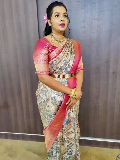 A full-length view of the simple party look. The half-up hairstyle is decorated with a single flower for a touch of freshness.