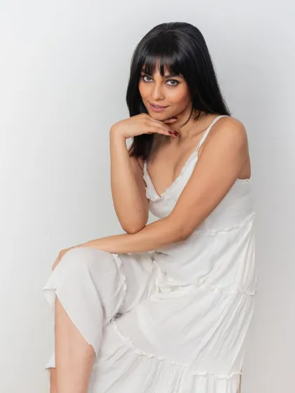 Another beautiful shot of our model wearing the clip-on front bangs. Her confident pose shows how a simple hairpiece can completely elevate your look.