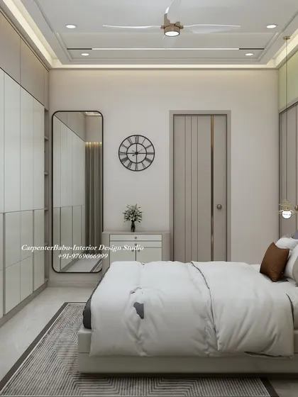 A full-length mirror is strategically placed to make the room feel larger and brighter. The simple clock and minimalist dresser maintain the room's uncluttered aesthetic.