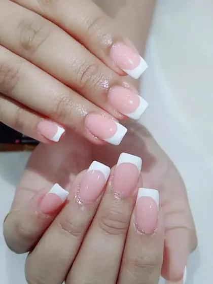 A classic square-tipped French manicure, showing the clean lines and glossy finish that make this style so popular.