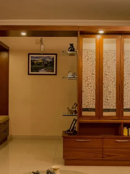 The partition unit shown in its closed state. The fabric panels create a textured, translucent wall that separates the foyer from the living area while still allowing light to pass through.