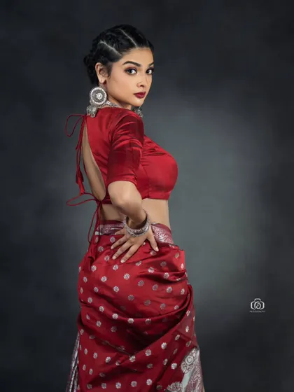 A back view of the modern saree-drape, showing the unconventional styling. This shot highlights the versatility of traditional garments when paired with a contemporary vision.