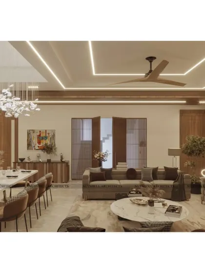 An integrated view of the living and dining areas, showing how we use consistent wood tones and a cohesive lighting scheme to unify the large, open-plan space. The design ensures that each zone feels distinct yet connected.