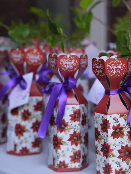 We also arrange thoughtful return gifts for your guests. For this event, we provided beautifully packaged plant saplings, a unique and eco-friendly thank you gift.