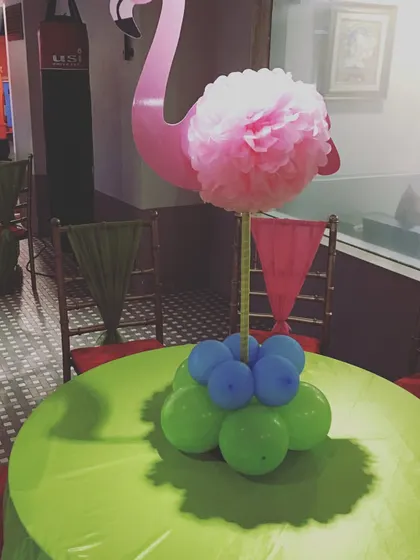 Details matter when creating a themed party. This flamingo and balloon centerpiece was part of the decor for a kids' birthday, showing how I can help bring your party's theme to life.