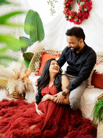 A candid and loving moment between partners. The genuine smiles and gentle touches make this a heartwarming and authentic portrait.