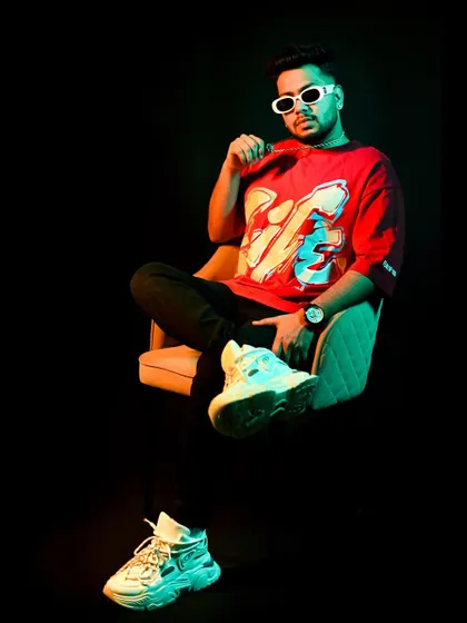 A shot from a recent photoshoot. The colorful lighting reflects the vibrant energy of my music.