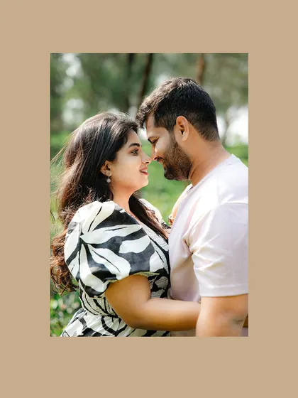 A close-up of a couple's loving gaze, framed in a warm brown border.