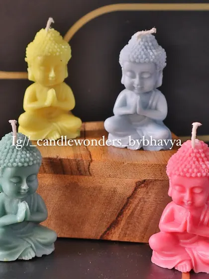 A set of pastel-colored Buddha candles, perfect for creating a calm and serene atmosphere.