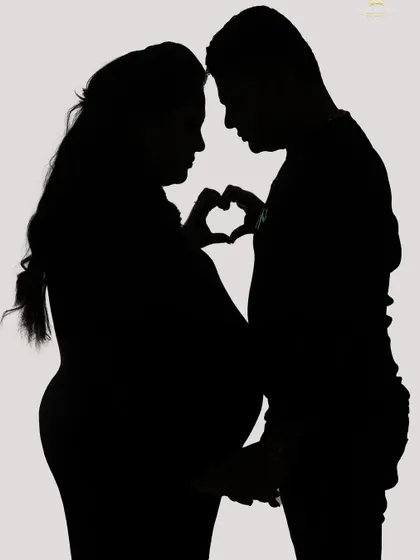Sometimes, a silhouette tells the most powerful story. We use creative lighting in our studio to craft these artistic and romantic portraits that focus on the beautiful shape of the baby bump and the connection between partners.