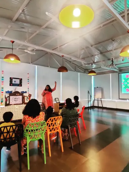 A wider view of a session in progress, showing how I use the space, props, and even a projector to create a multi-sensory environment. This approach helps in telling bigger, more epic tales.