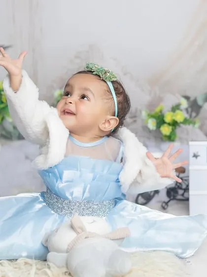 Kridha turns one! This winter princess theme with a cozy jacket over a blue gown is simply magical.