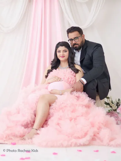 A classic seated portrait of the expecting couple. This pose is comfortable for the mom-to-be and results in a beautiful, timeless photograph.