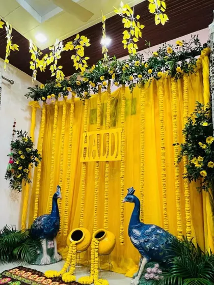 A full view of the compact yet vibrant Haldi setup at home, showing how we can transform any space into a festive celebration zone.