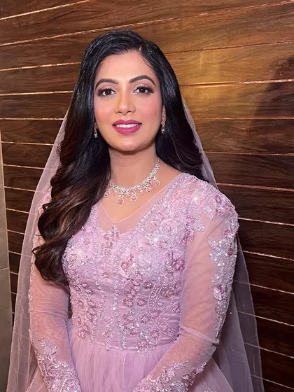 Her smile shows how confident and beautiful she feels in this classic, princess-inspired hairstyle.