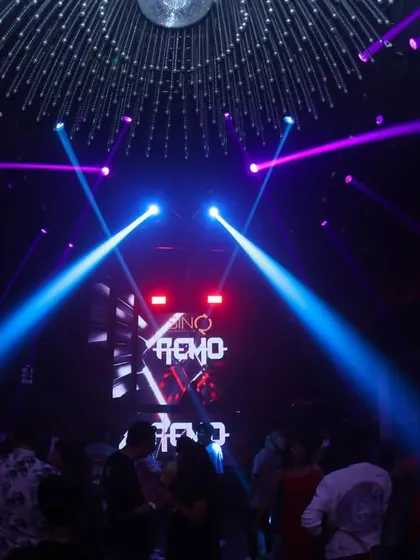 Laser beams cutting through the darkness at SinQ Nightclub in Goa. The light show is an essential part of the superclub experience I provide.