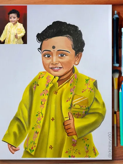 This little boy in a bright yellow traditional outfit makes for a very cheerful A3 portrait. I used colored pencils to bring out the festive colors and his happy smile.