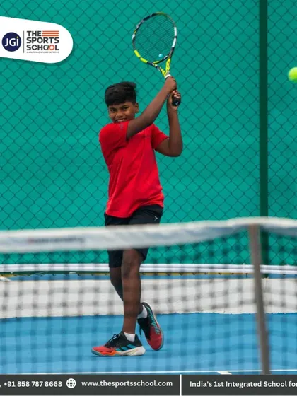 A player hits a powerful forehand, his smile showing the joy and passion he has for the game.
