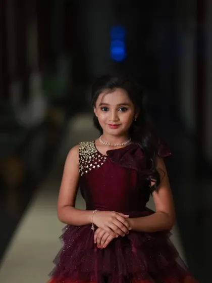 A professional shot of the 10th birthday girl in her color-layered gown.