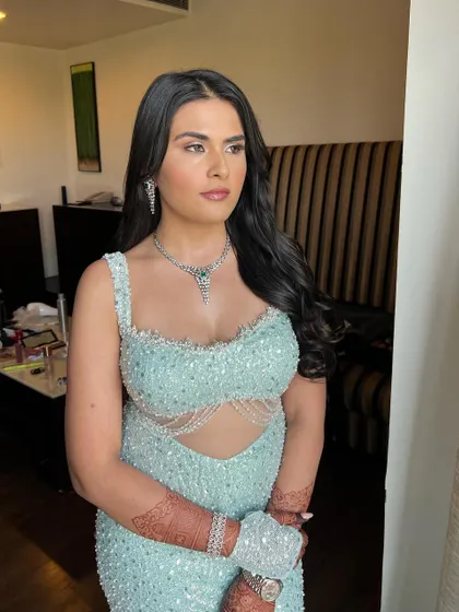 Another angle of this stunning ice blue engagement look. The focus is on flawless, glowing skin and subtle definition to create a truly magical and modern style.
