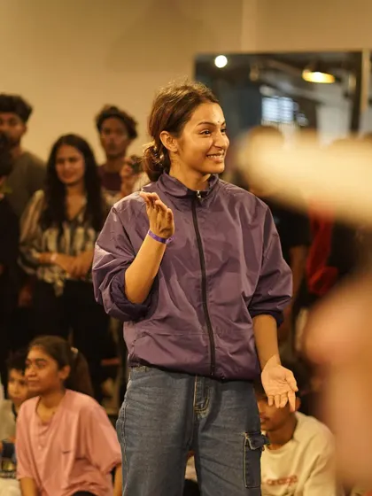 A candid moment of a b-girl enjoying the atmosphere at one of our jams. Beyond the battles, our events are about community, connection, and having a good time.