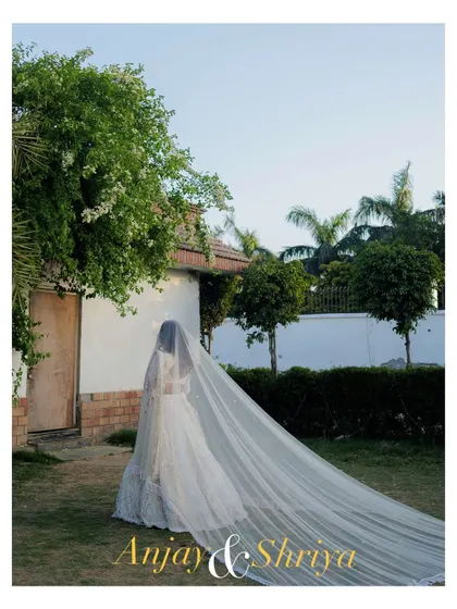 An elegant and dreamy portrait of a bride-to-be on her engagement day. The long, flowing veil creates a sense of romance and anticipation for the journey ahead.