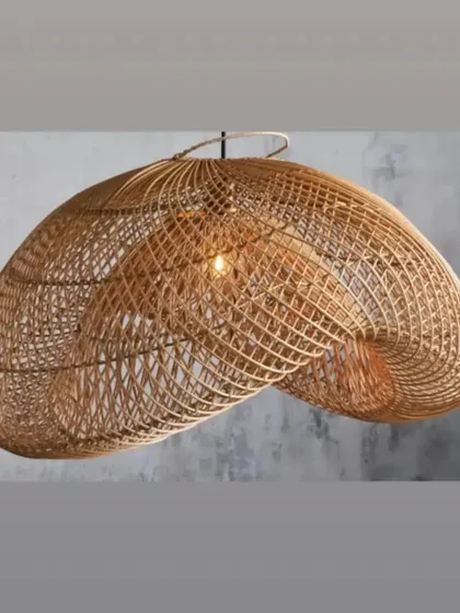 A closer look at our intricately woven rattan pendant light. The open weave creates beautiful patterns of light and shadow, adding depth and texture to a room even when unlit.