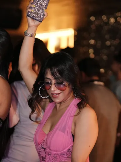 A close-up of a guest dancing, showcasing the fun and carefree vibe of the night.