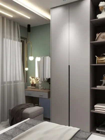 A close-up of the wardrobe and vanity area in the Godrej Park Retreat bedroom, highlighting the sleek, handleless doors and open shelving.