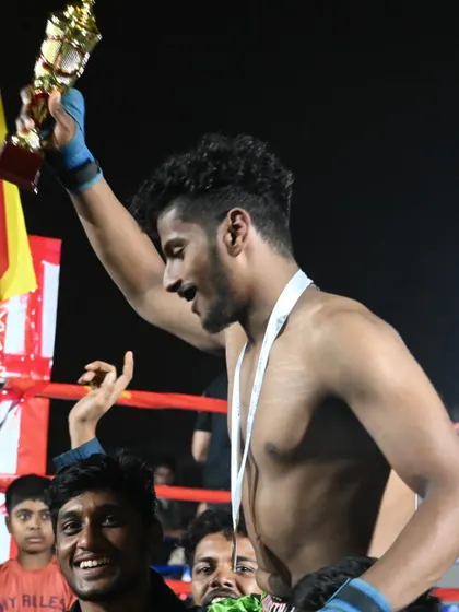 A moment of triumph for our fighter, celebrating his victory at the Karnataka State Muay Thai Championship.