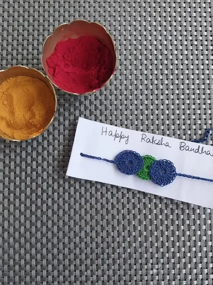 A simple three-circle design rakhi. This minimalist style is great for those who prefer something subtle.