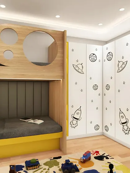 An outer space-themed bunk bed in yellow and grey. The rocket and planet decals on the wardrobe are a fun detail, and the circular cutouts on the top bunk are like spaceship windows.
