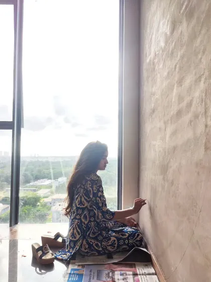 In my element. The process often starts quietly, sitting on the floor and sketching the first lines directly onto the wall.