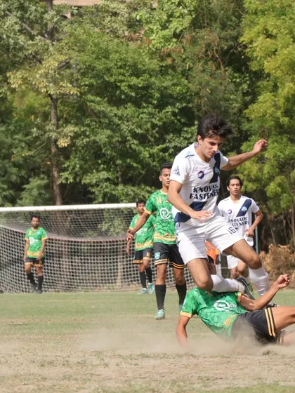 An action shot of a player executing a sliding tackle, capturing the grit and determination we expect from every Wolf.