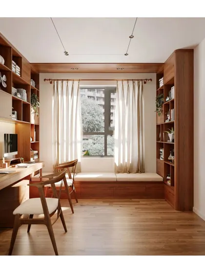 A warm and inviting home office or study. We used rich wood for the custom-built bookshelves and desk, and added a window seat to create a comfortable and productive environment.