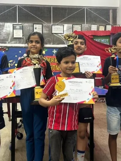 A group of our youngest winners from a recent tournament. Their smiles and trophies are the best reward for our coaching efforts.