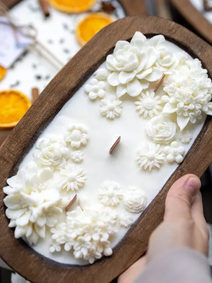 My boat candles are a bestseller for a reason. This one, filled with white wax flowers and featuring a wooden wick, is a beautiful and unique decor piece.
