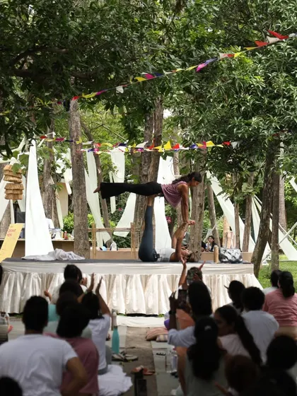Performing Acro Yoga on stage at Zenfest. It's such a joy to share this practice of trust and connection with a larger audience.