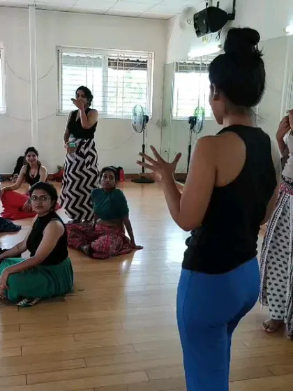 An instructor provides guidance during the Indian Fusion Weekender. These intensives are about more than just dance; they are about fostering a supportive community of artists.