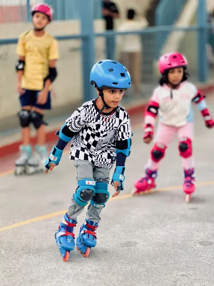 This skater is focused on his form, keeping his body low and balanced. Our coaches provide continuous feedback to help students refine their technique during every skating class.