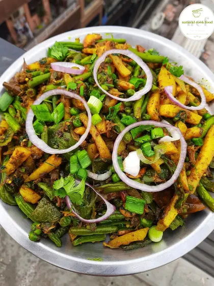 'Kanghou', a popular savory side dish from Manipur. It's a simple stir-fry of mixed vegetables, perfect as an accompaniment.