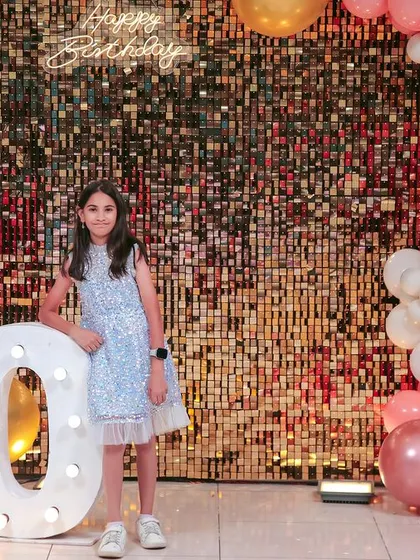 A thrilling 'Hot Wheels' themed birthday party, with checkered flags, car cutouts, and a custom racetrack backdrop, perfect for little speed enthusiasts.