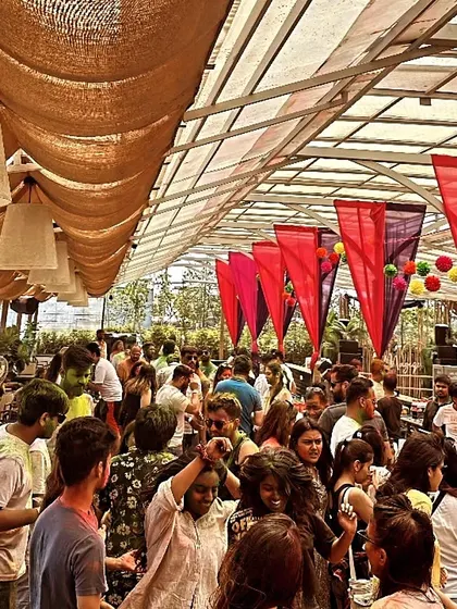 The daytime party scene at the Holi Invasion at Magique. The colorful decorations matched the festival's spirit perfectly.