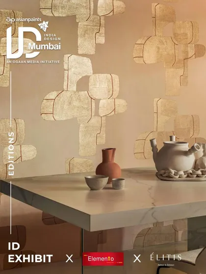 A promotional graphic for our Élitis showcase at India Design, featuring a wallcovering with abstract, block-like shapes. This design highlights the brand's focus on artistic, modern patterns that double as wall art.